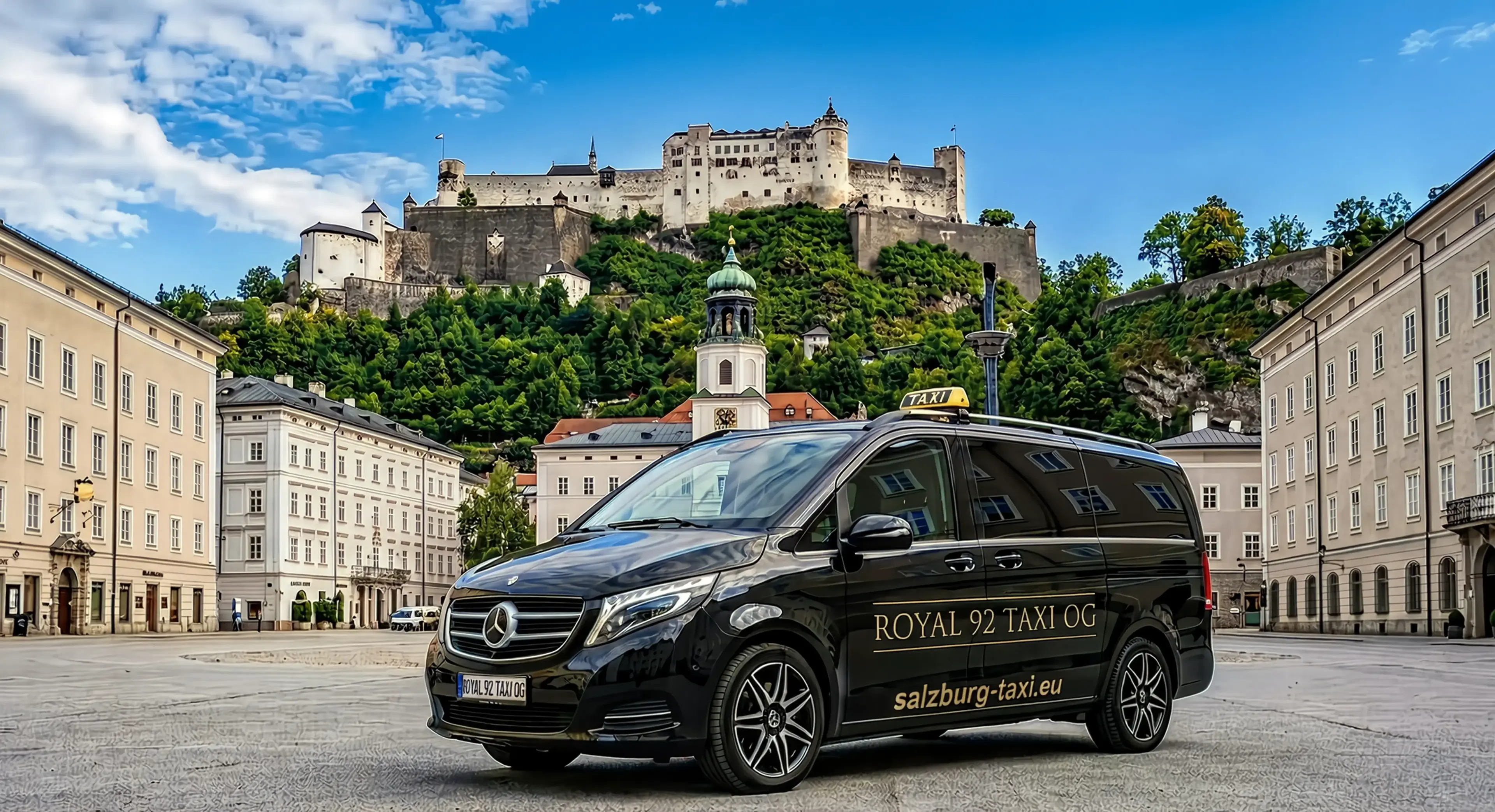 Salzburg Taxi in Salzburg Old Town below Hohensalzburg Fortress Black Salzburg Taxi Mercedes van in Salzburg Old Town with Hohensalzburg Fortress above the historic city centre